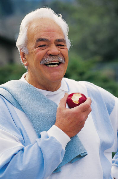 Guy eats an apple - www.HowCanIRetire.net